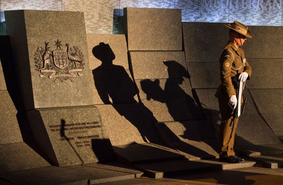 An Australian soldier stands at the Australian War Memorial during an Anzac Day dawn service in London on April 25, 2017.