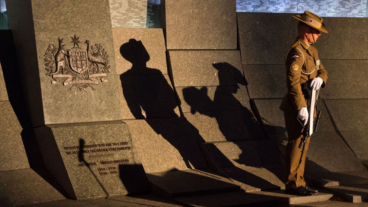 An Australian soldier stands at the Australian War Memorial during an Anzac Day dawn service in London on April 25, 2017.