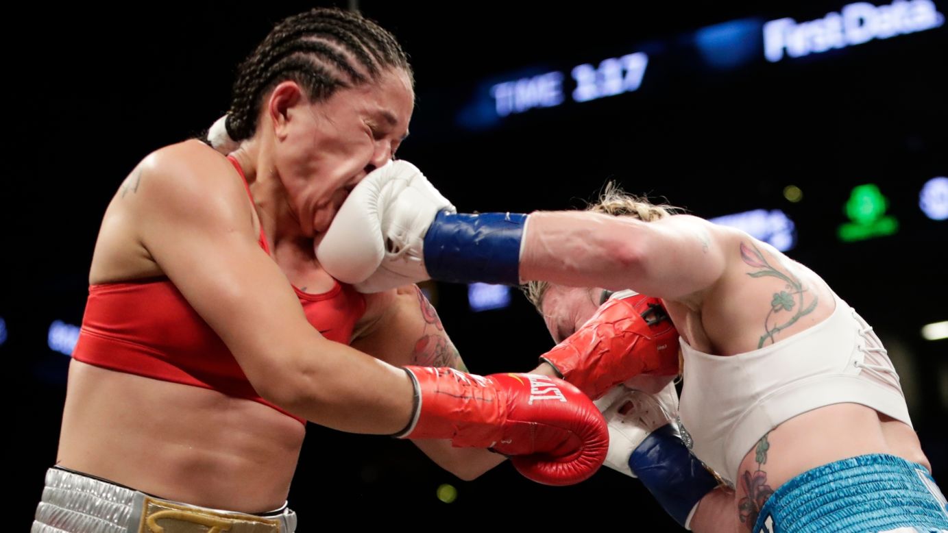 Heather Hardy, right, punches Paola Torres during their featherweight bout in New York on Saturday, April 21. Hardy won by unanimous decision and remains undefeated in her professional boxing career.