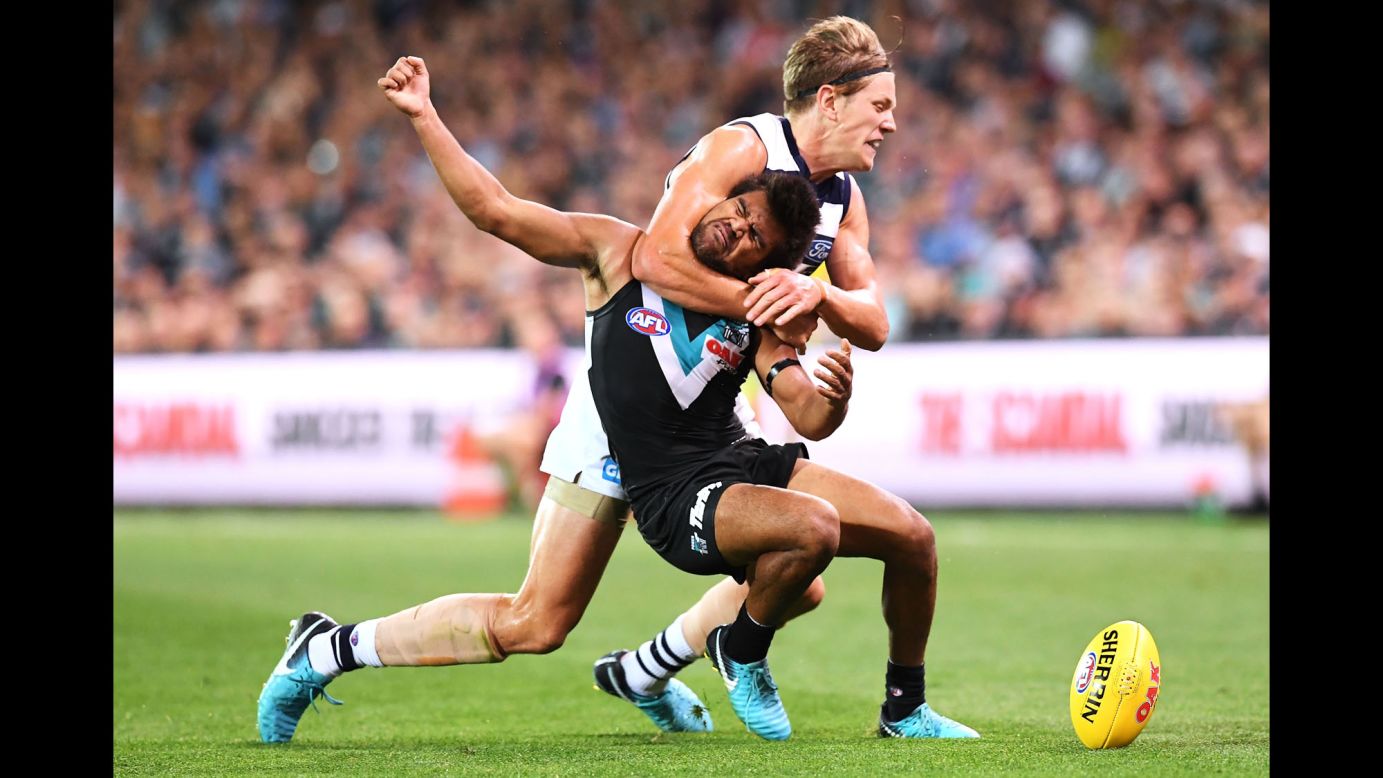 Port Adelaide's Jake Neade is tackled by Geelong's Rhys Stanley during an Australian Football League match on Saturday, April 21.