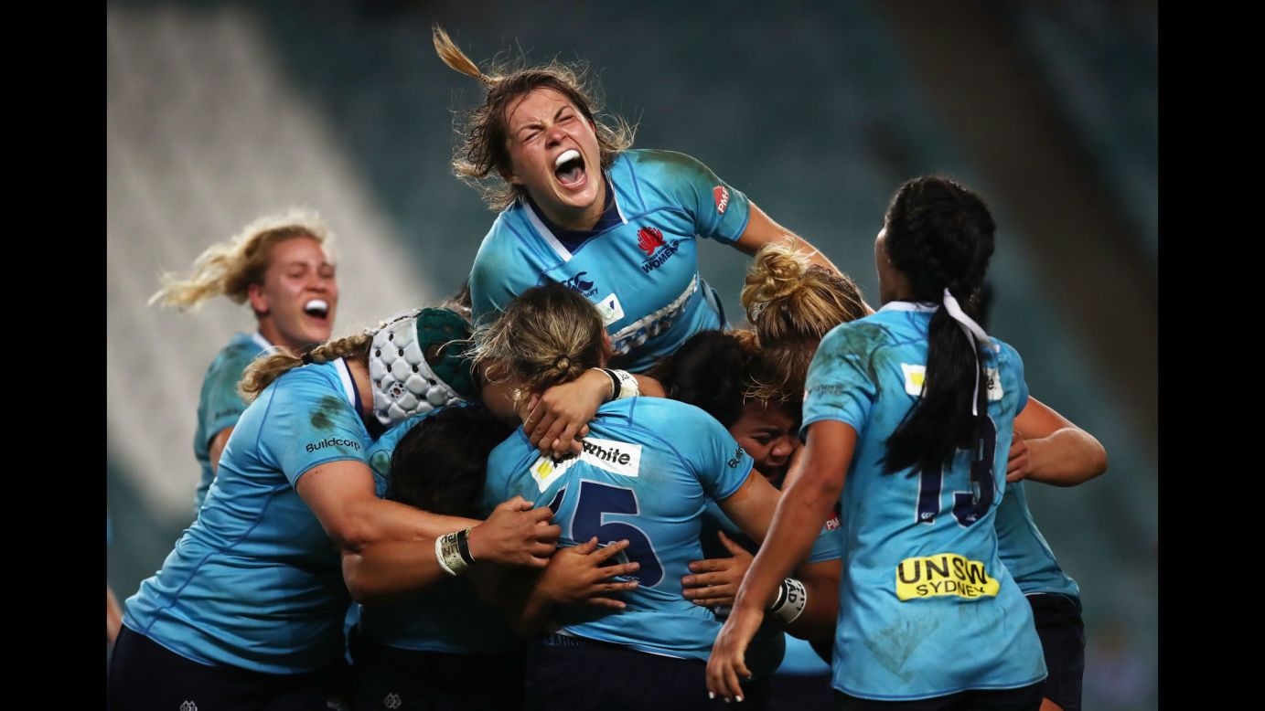 Rugby player Grace Hamilton, top, celebrates with her New South Wales teammates after they won the Super W Grand Final in Sydney on Friday, April 20.