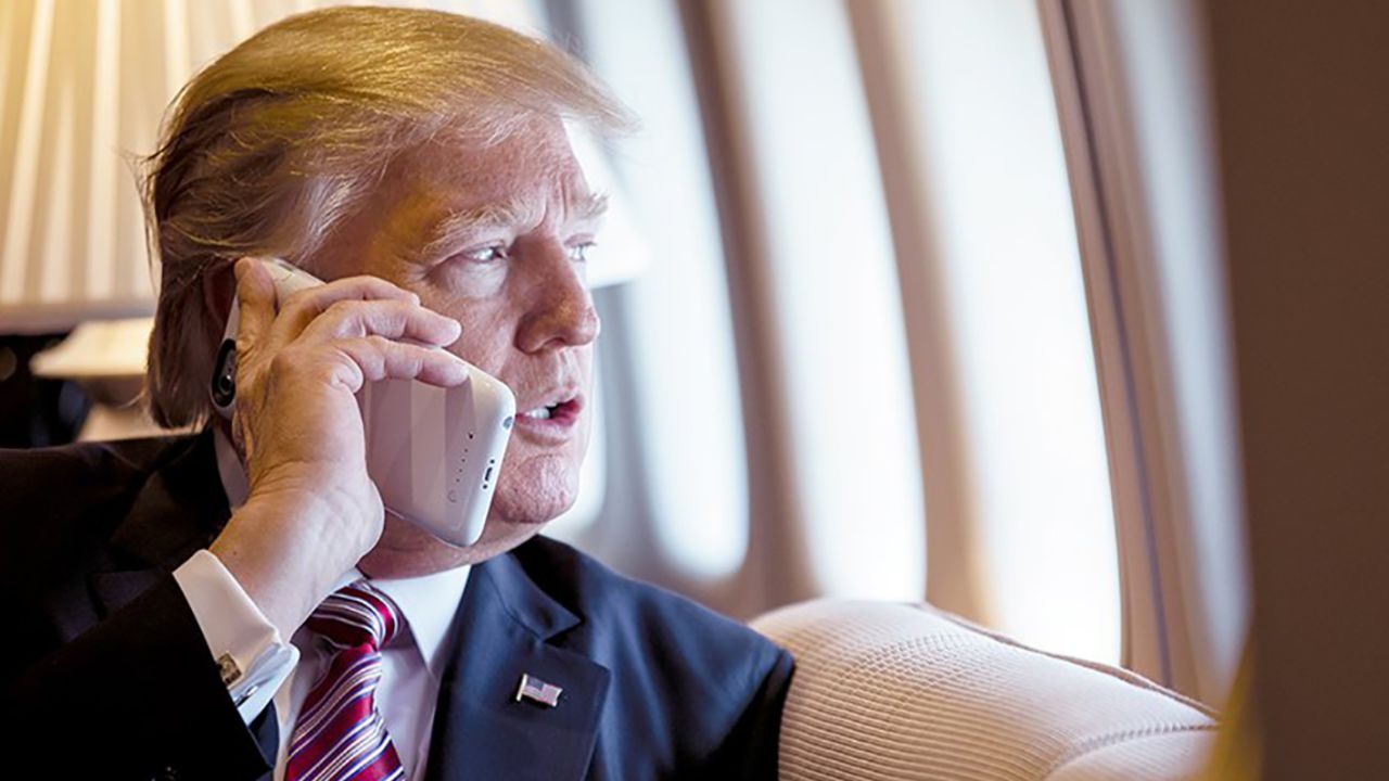 President Donald Trump talks on the phone aboard Air Force One during a flight to Philadelphia, Pennsylvania, to address a joint gathering of House and Senate Republicans, Thursday, January 26, 2017. This was the Presidentas first Trip aboard Air Force One. (Official White House Photo by Shealah Craighead)