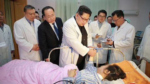 North Korean dictator Kim Jong Un pays a hospital visit to two Chinese tourists who survived of a horror bus crash that killed 36 in North Korea on Sunday. 32 of the dead were Chinese, prompting President Xi Jinping to demand an 'all-out effort' by North Korea to save the survivors, who are in a critical state.