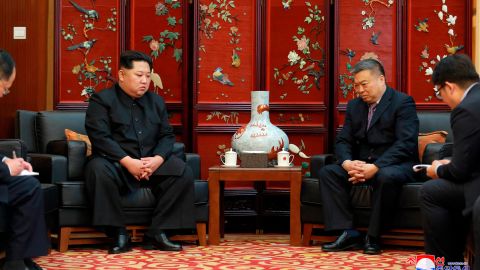In this photo provided  by the North Korean government, North Korean leader Kim Jong Un, left, meets China's ambassador to North Korea Li Jinjun at the the Chinese Embassy in Pyongyang following Sunday's traffic accident.