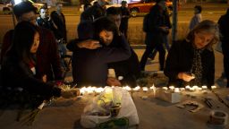 TORONTO, ON - APRIL 23: People embrace as they lay candles and leave messages at a memorial for victims of a crash on Yonge St. at Finch Ave., after a van plowed into pedestrians on April 23, 2018 in Toronto, Canada. A suspect identified as Alek Minassian, 25, is in custody after a driver in a white rental van collided with multiple pedestrians killing nine and injuring at least 16. (Photo by Cole Burston/Getty Images)