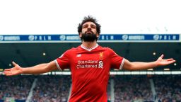 Liverpool's Egyptian midfielder Mohamed Salah celebrates scoring their second goal during the English Premier League football match between West Bromwich Albion and Liverpool at The Hawthorns stadium in West Bromwich, central England, on April 21, 2018. (Photo by Lindsey PARNABY / AFP) / RESTRICTED TO EDITORIAL USE. No use with unauthorized audio, video, data, fixture lists, club/league logos or 'live' services. Online in-match use limited to 75 images, no video emulation. No use in betting, games or single club/league/player publications. /         (Photo credit should read LINDSEY PARNABY/AFP/Getty Images)