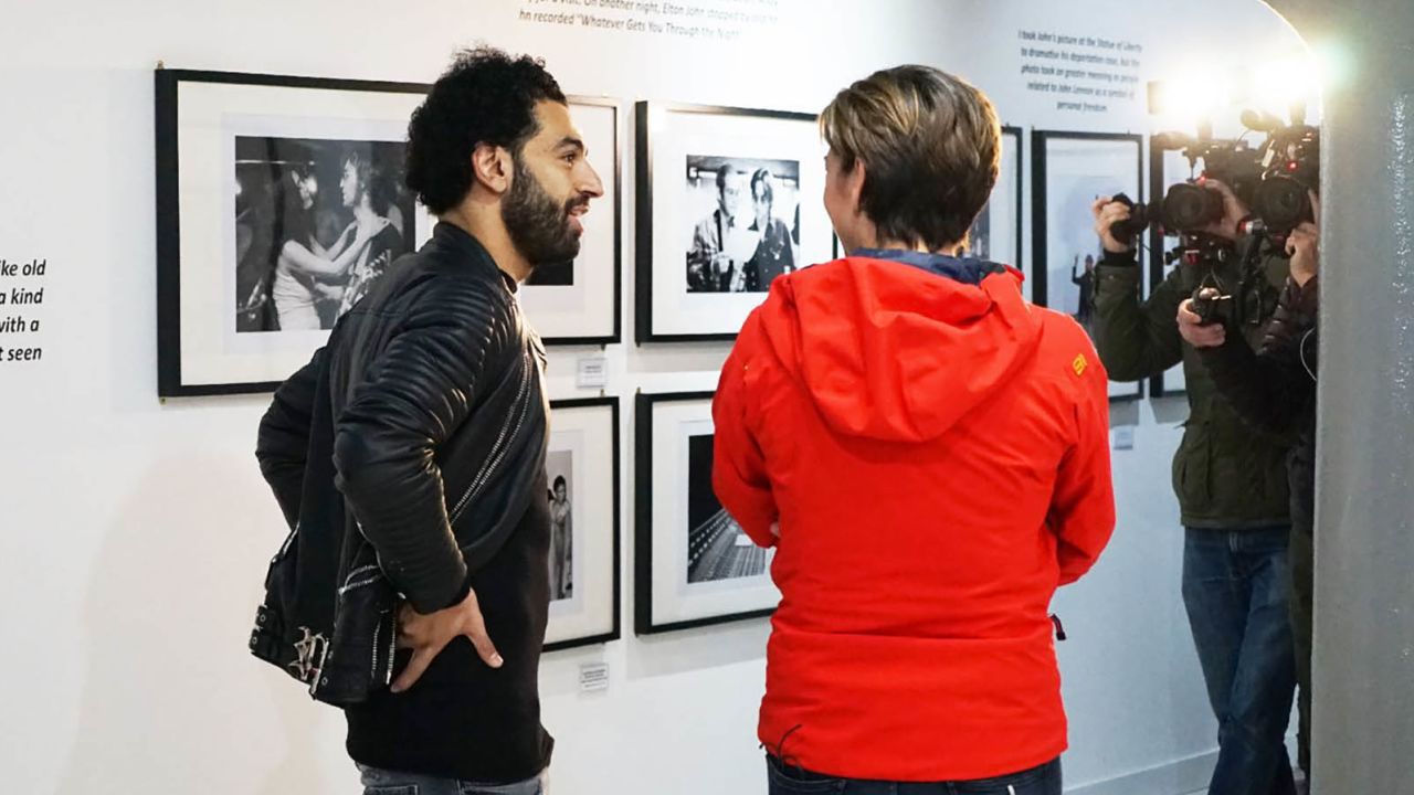 Salah takes a look around the exhibits at the Beatles Museum.