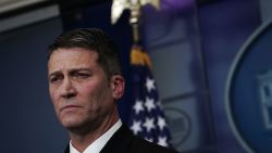 Ronny Jackson listens during the daily White House press briefing at the James Brady Press Briefing Room of the White House January 16, 2018.