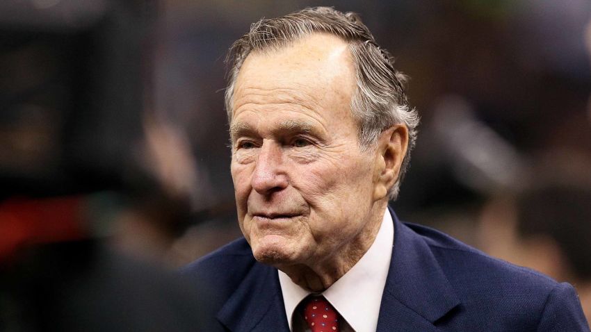 NEW ORLEANS - JANUARY 24:  Former US President George H. W. Bush (R) stands on the field prior to the New Orleans Saints playing against the Minnesota Vikings during the NFC Championship Game at the Louisana Superdome on January 24, 2010 in New Orleans, Louisiana.  (Photo by Jed Jacobsohn/Getty Images)