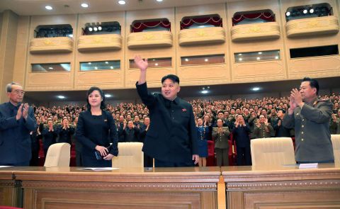 An undated photo published by North Korean state media in May 2013 shows Ri alongside Kim at a performance in Pyongyang. 