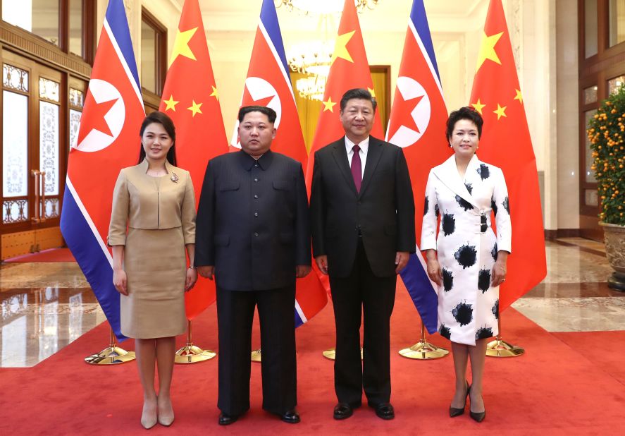 Ri and Kim pose alongside Chinese President Xi Jinping and his wife, Peng Liyuan, during a state visit to Beijing in March 2018.