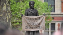 A statue of suffragist and women's rights campaigner Millicent Fawcett by British artist Gillian Wearing is unveiled in Parliament Square in London on April 24, 2018. - The first statue of a woman on Parliament Square in London was to be unveiled on April 24 to celebrate the 100th anniversary of women winning the right to vote in Britain. The statue of women's rights campaigner Millicent Fawcett will stand alongside those of 11 men, including Britain's wartime leader Winston Churchill, Indian independence icon Mahatma Gandhi and anti-apartheid leader Nelson Mandela. (Photo by Ben STANSALL / AFP) (Photo credit should read BEN STANSALL/AFP/Getty Images)
