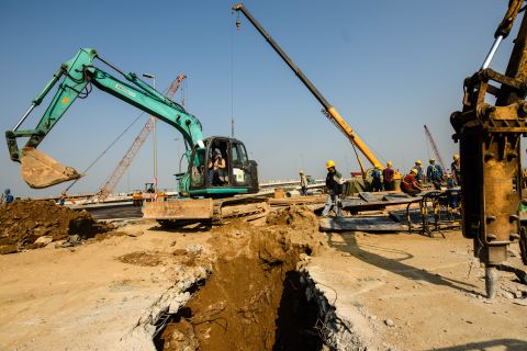 Construction workers building a road in Macau that will connect the territory to the Hong Kong-Zhuhai-Macau Bridge. 