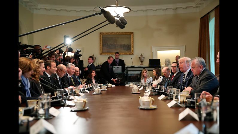 The two Presidents sit with their staff members on April 24, in the White House Cabinet Room.