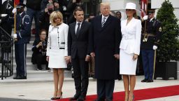 President Donald Trump, first lady Melania Trump, French President Emmanuel Macron and his wife Brigitte Macron stand together at the beginning of the State Arrival Ceremony at the White House in Washington, Tuesday, April 24, 2018. (AP Photo/Carolyn Kaster)