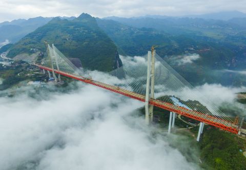 The Beipanjiang Suspension Bridge soars a terrifying 1,854 feet above a river in southwest China's Guizhou province.