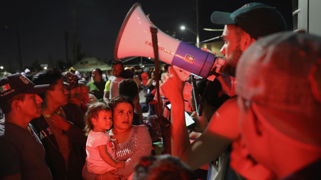 Migrants in the caravan wait for buses to take them from Hermosillo, Mexico, to the next stop on their journey.