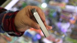 BOSTON, MA - NOVEMBER 15: A Juul e-cigarette is pictured for sale at Fast Eddie's Smoke Shop in the Allston neighborhood of Boston on Nov. 15, 2017. Shoppers must be 21 years of age. Concerns are growing over underage use of the new easy-to-conceal form of e-cigarette that looks like a thumb drive. It is sweeping schools, where teens surreptitiously use it for nicotine and THC, sometimes even in class. (Photo by Suzanne Kreiter/The Boston Globe via Getty Images)
