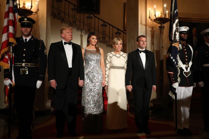 Trump and first lady Melania Trump arrive for a state dinner with Macron and his wife, Brigitte Macron, at the White House.