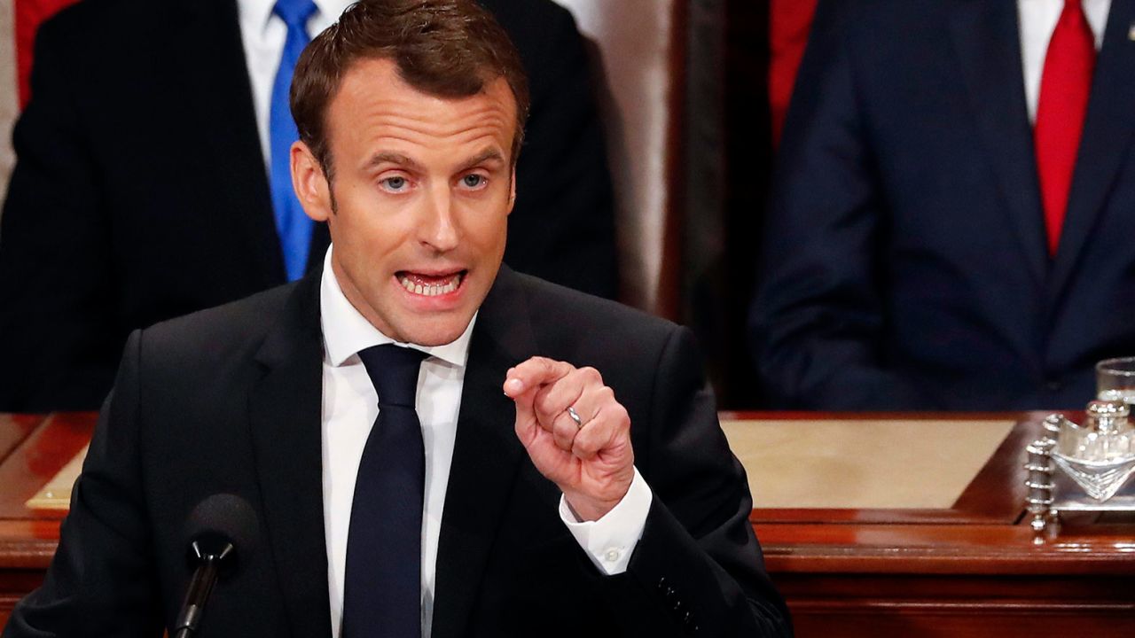 French President Emmanuel Macron speaks to a joint meeting of Congress on Capitol Hill in Washington, Wednesday, April 25, 2018. Standing behind him are Vice President Mike Pence and House Speaker Paul Ryan of Wis. (AP Photo/Pablo Martinez Monsivais)