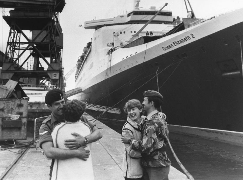 During the Falklands War in 1982, the QE2 was converted to a troopship, with dormitories for 3,000 British soldiers. Here, Lance-Corporal Michael Hearn (left) says goodbye to his girlfriend Sandra Kelly, while his brother Lance-Corporal Gary Hearn gives his wife Faye a farewell hug, before departing from Southampton for the Falkland Islands.