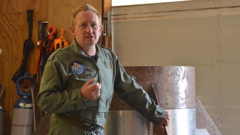 Peter Madsen stands next to a full-sized model of a rocket's motor section with fins in a May 31, 2017, photo.