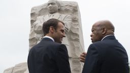 France's President Emmanuel Macron stands with US Rep. John Lewis(D-GA) on April 25, 2018 in front of the Martin Luther King,Jr. Memorial in Washington, DC. (Photo by Eric BARADAT / AFP)        (Photo credit should read ERIC BARADAT/AFP/Getty Images)