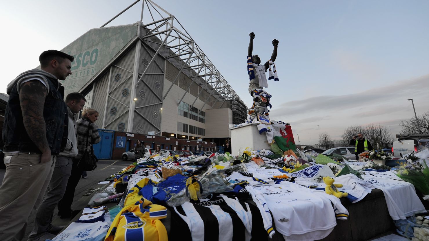 Fans pay tribute to former Leeds United player Gary Speed in 2011 outside the club's Elland Road stadium.