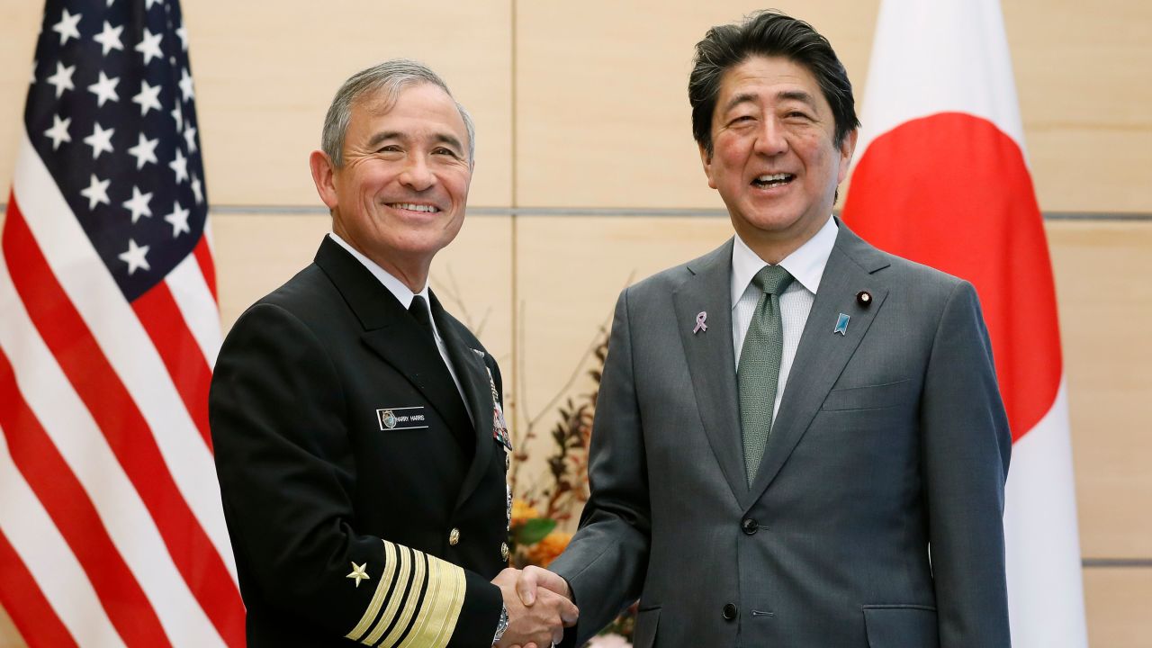 Harry Harris shakes hands with Japanese Prime Minister Shinzo Abe at the prime minister's official residence in Tokyo on November 16.