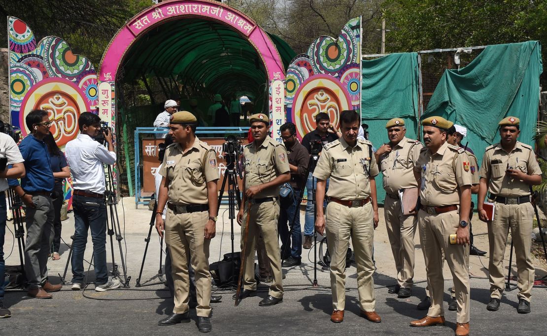 Indian policemen stand guard outside the ashram of controversial Indian guru Asaram Bapu on April 25, 2018.