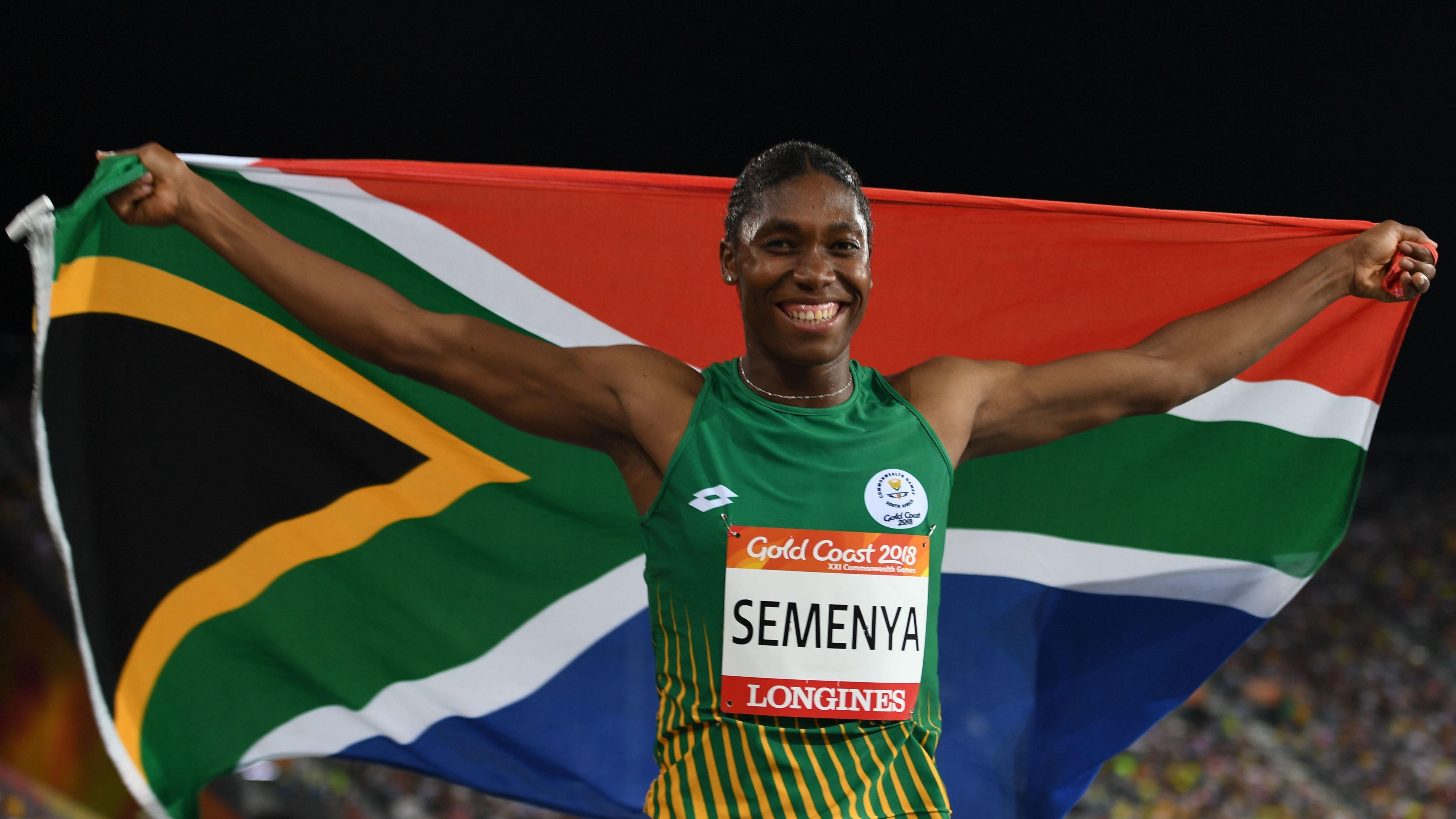 Caster Semenya celebrates with a flag after winning the 800m final during the 2018 Commonwealth Games.