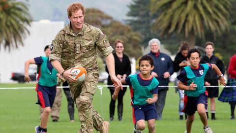 Harry plays touch rugby with schoolchildren during a trip to New Zealand. Palmerston North, New Zealand, May 2015.