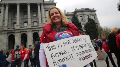 Sharon Roybal rallies with her colleagues at the Colorado Capitol in Denver on April 26, 2018.