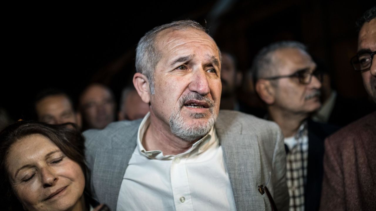Cumhuriyet chairman Akin Atalay (R) and his wife Adalet Atalay speak to journalists after being released from Silivri prison on April 26, 2018.