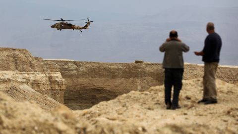 An Israeli military helicopter takes part in the search mission Thursday in southern Israel.