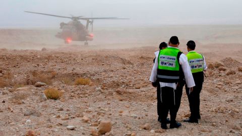 Israeli rescue services search for the teens Thursday after flash floods swept through the area.