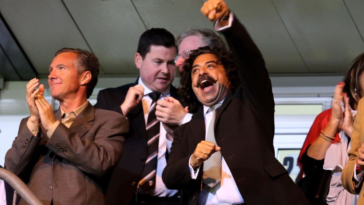Khan celebrates a Fulham goal.