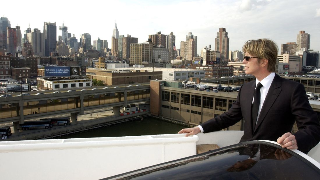 The late David Bowie disembarks the QE2 in New York from England to begin a tour of North America in July 2002.