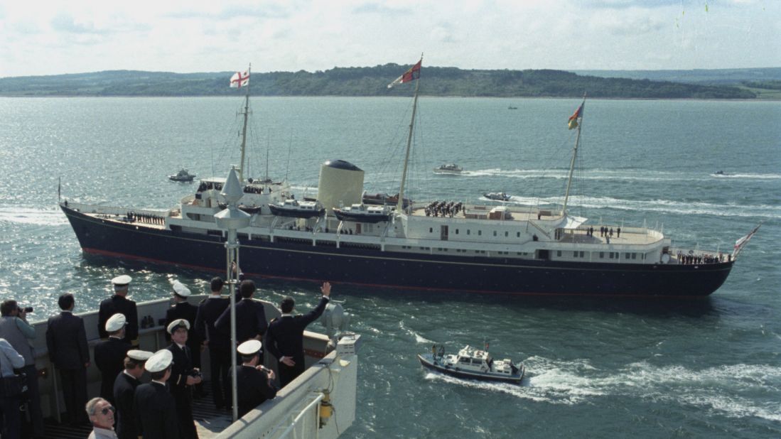 Sailors aboard the QE2 wave towards the Royal Yacht Britannia -- with the Queen Mother aboard -- on June 11, 1982 as the ship returned to Southampton after serving in the Falklands.