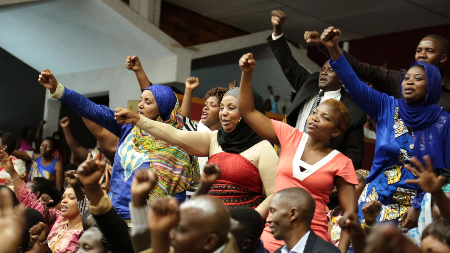 Rwandan people react during the Constitution amendment debate at the parliament in Kigali in 2015 that allowed Paul Kagame a third term in power as president. Rwanda has the highest percentage of women (61%) in its parliament in the world. 