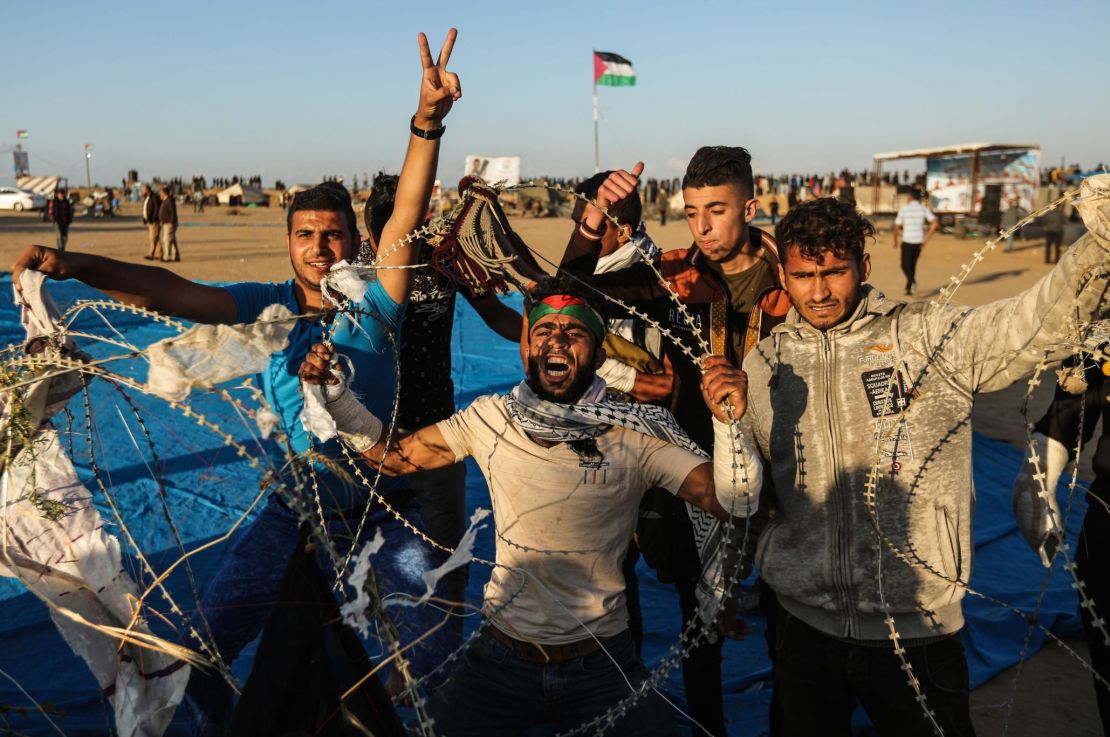 Palestinian protesters try to pull down part of the Gaza-Israel fence on April 22.