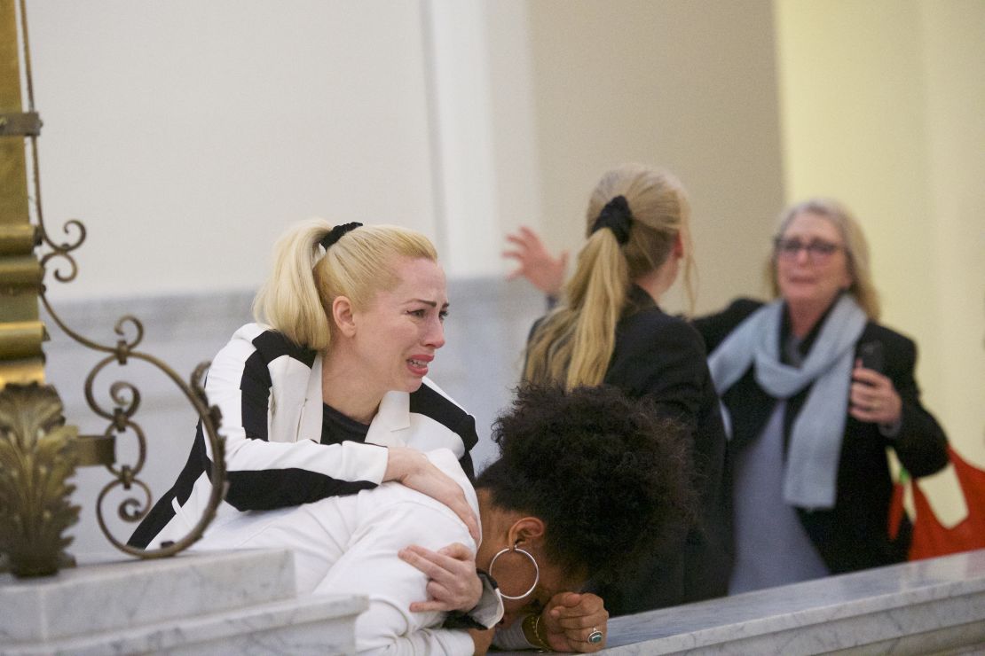 Bill Cosby accusers Caroline Heldman, left, Lili Bernard, second from left, and Victoria Valentino, far right, react after the verdict was delivered.