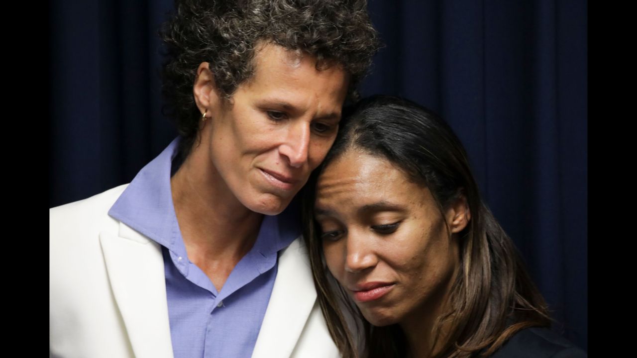 Andrea Constand, left, stands with prosecutor Kristen Feden after Thursday's verdict.