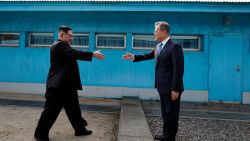 PANMUNJOM, SOUTH KOREA - APRIL 27:  North Korean Leader Kim Jong Un (L) and South Korean President Moon Jae-in (R) shake hands over the military demarcation line upon meeting for the Inter-Korean Summit on April 27, 2018 in Panmunjom, South Korea. Kim and Moon meet at the border today for the third-ever inter-Korean summit talks after the 1945 division of the peninsula, and first since 2007 between then President Roh Moo-hyun of South Korea and Leader Kim Jong-il of North Korea.  (Photo by Korea Summit Press Pool/Getty Images)