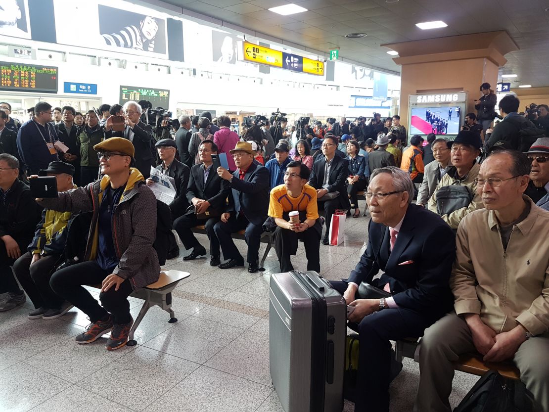 South Koreans watch the summit from a train station in Seoul on Friday.