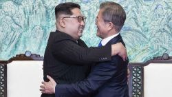 North Korean leader Kim Jong Un, left, and South Korean President Moon Jae-in embrace each other after signing on a joint statement at the border village of Panmunjom in the Demilitarized Zone, South Korea, Friday, April 27, 2018. (Korea Summit Press Pool via AP)