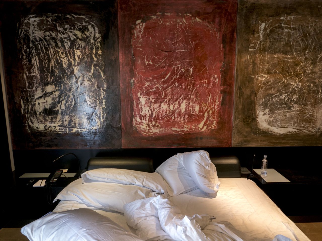 After a night in a hotel, guests gather up their belongings and depart.