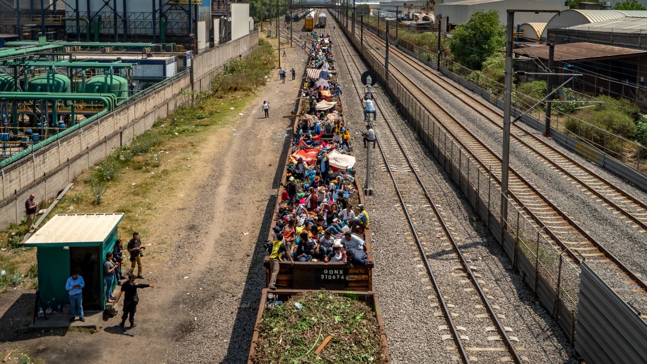 Migrants clamber onto trains they nickname "The Beast" to head north.