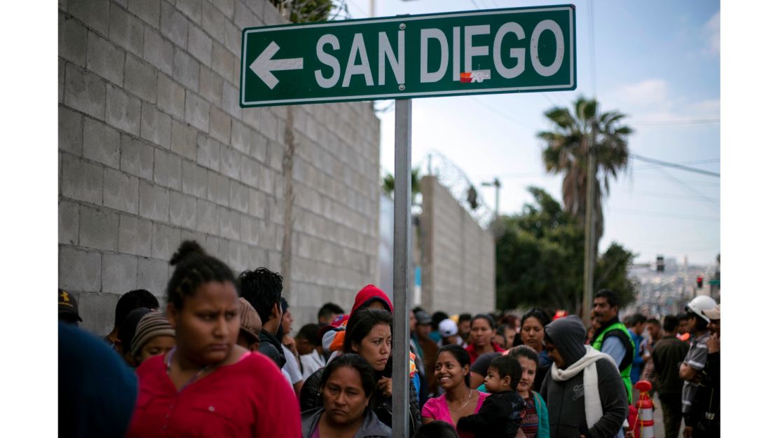 A sign outside a soup kitchen reminds people how close they are to the United States.