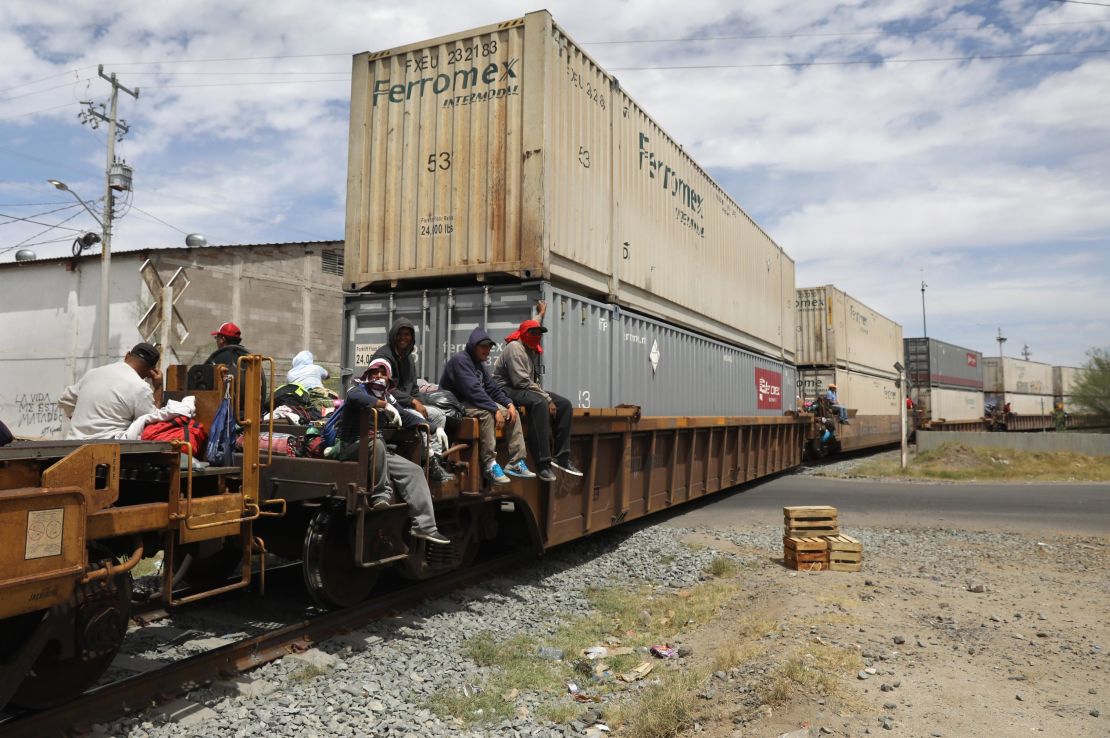 Migrants find what space they can on freight trains. 